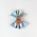 cloth napkins featuring a white background with bunny ring designs.