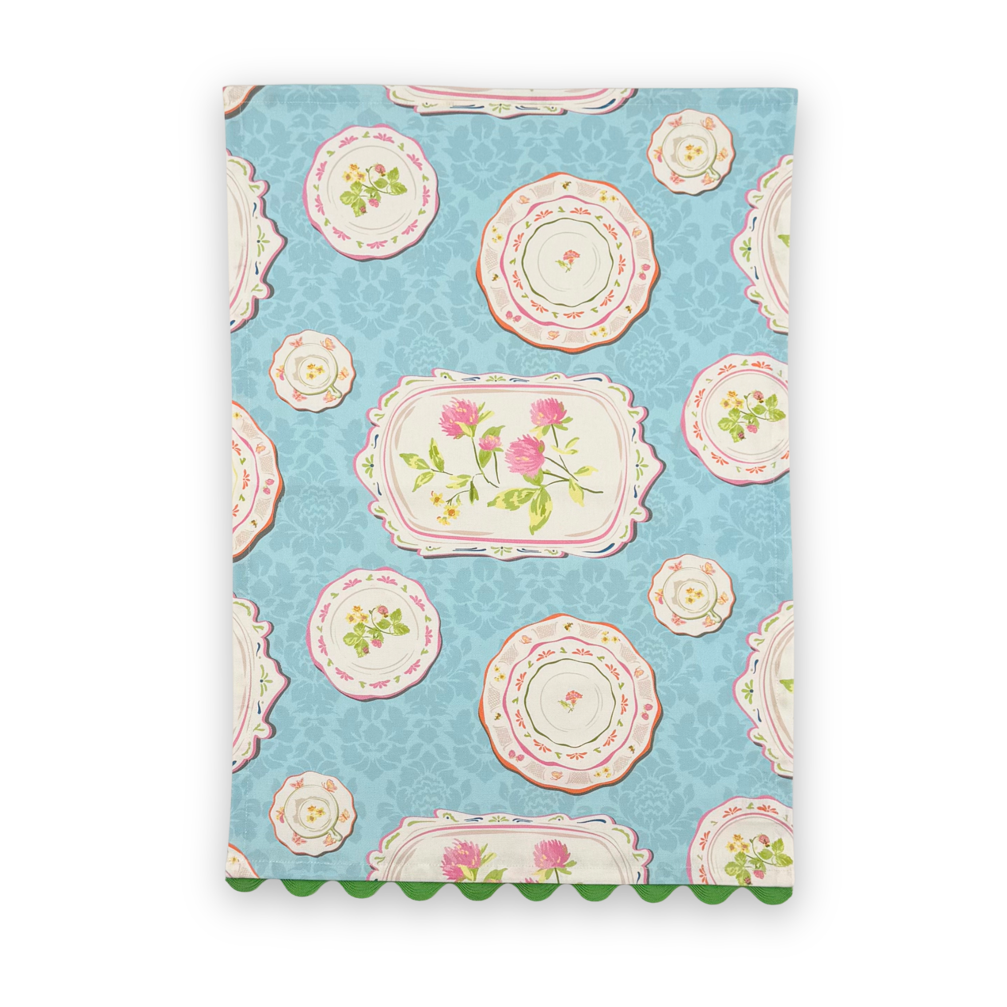 Society Hill Painted Plates cotton tea towel featuring decorative floral plates on a soft blue background with green scalloped trim.