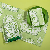 Green Society Hill Vintage Plates cloth table runner with matching napkins.