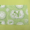 Green Sociey Hill Vintage Plates cloth table runner on a green background