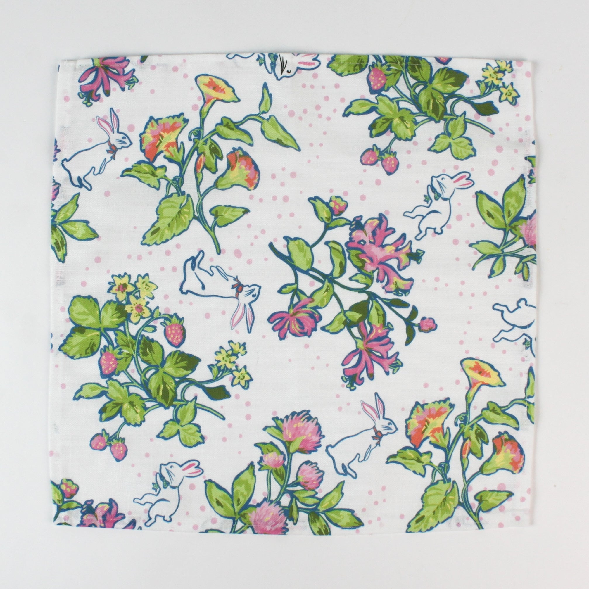 cloth napkins featuring a colorful botanical and bunny print on a white background.
