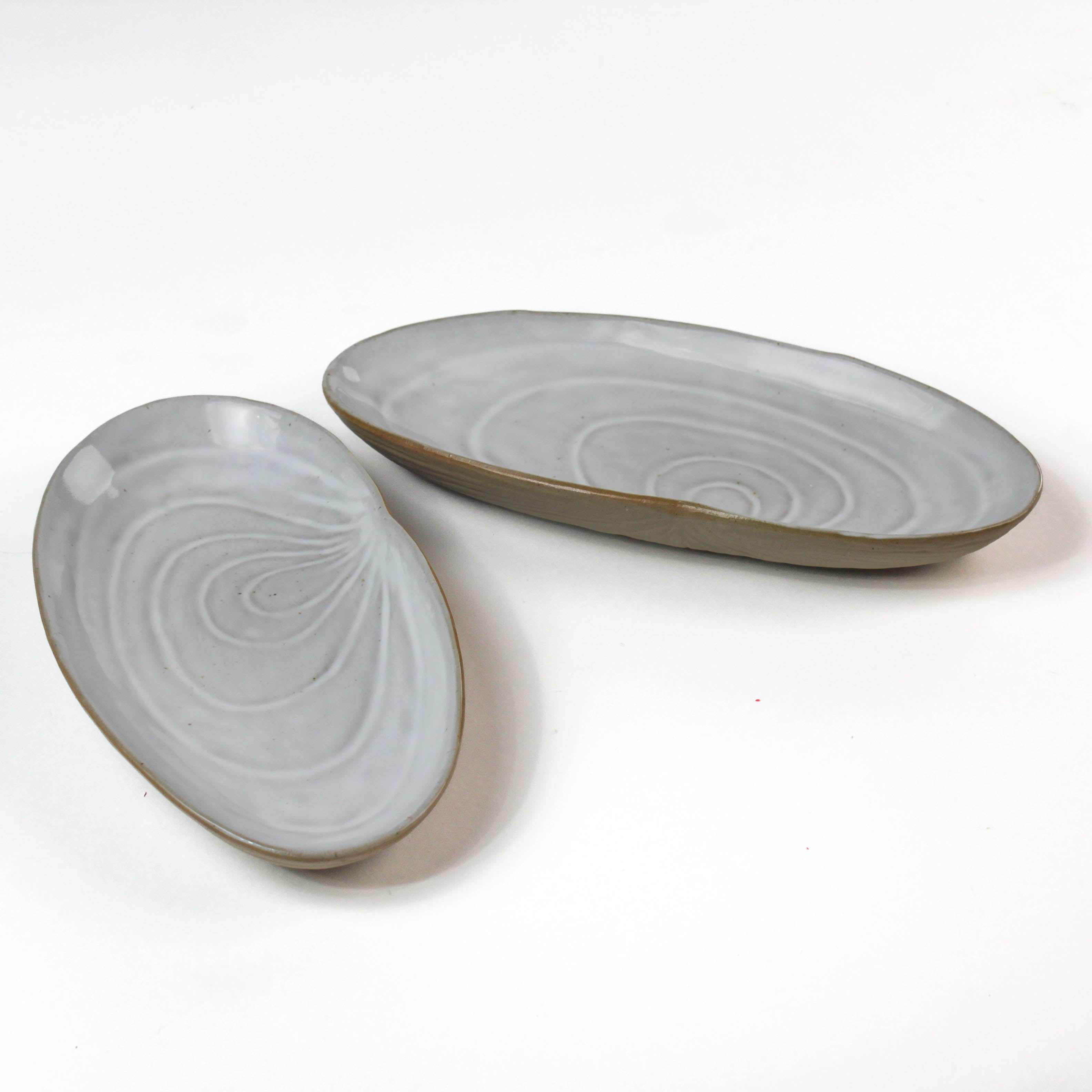 Shell shaped plate cream colored