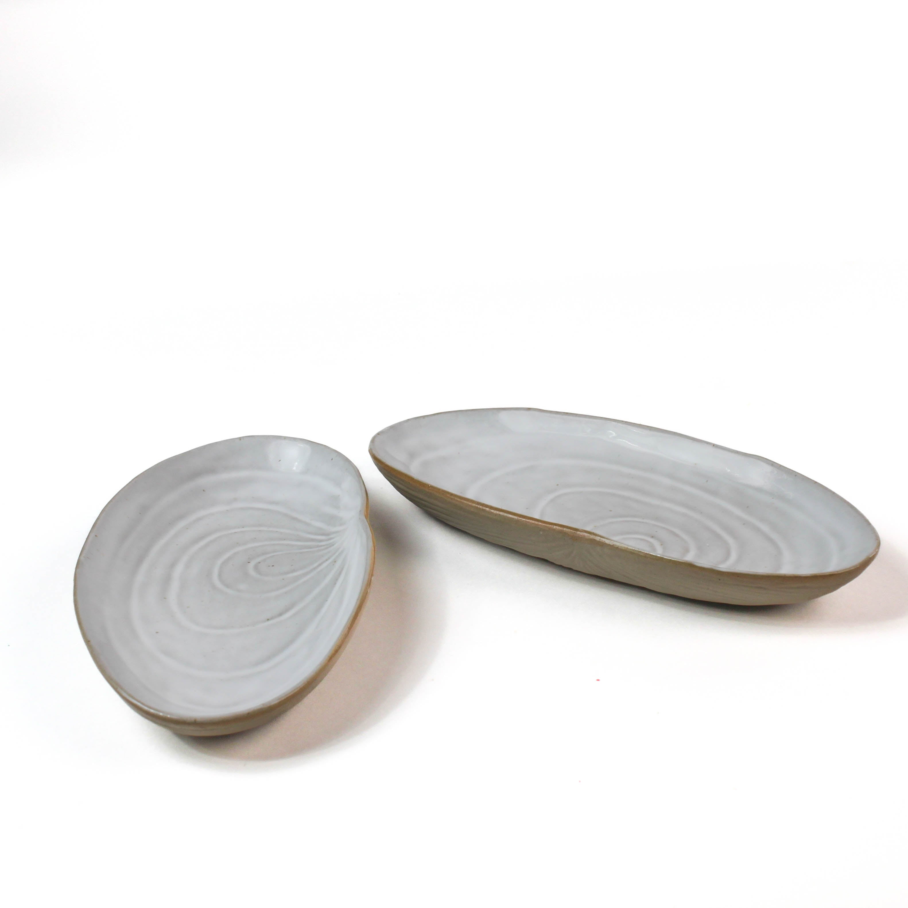 Shell shaped plate cream colored