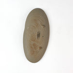 back of a Shell shaped plate cream colored