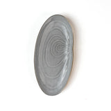 front of a Shell shaped plate cream colored