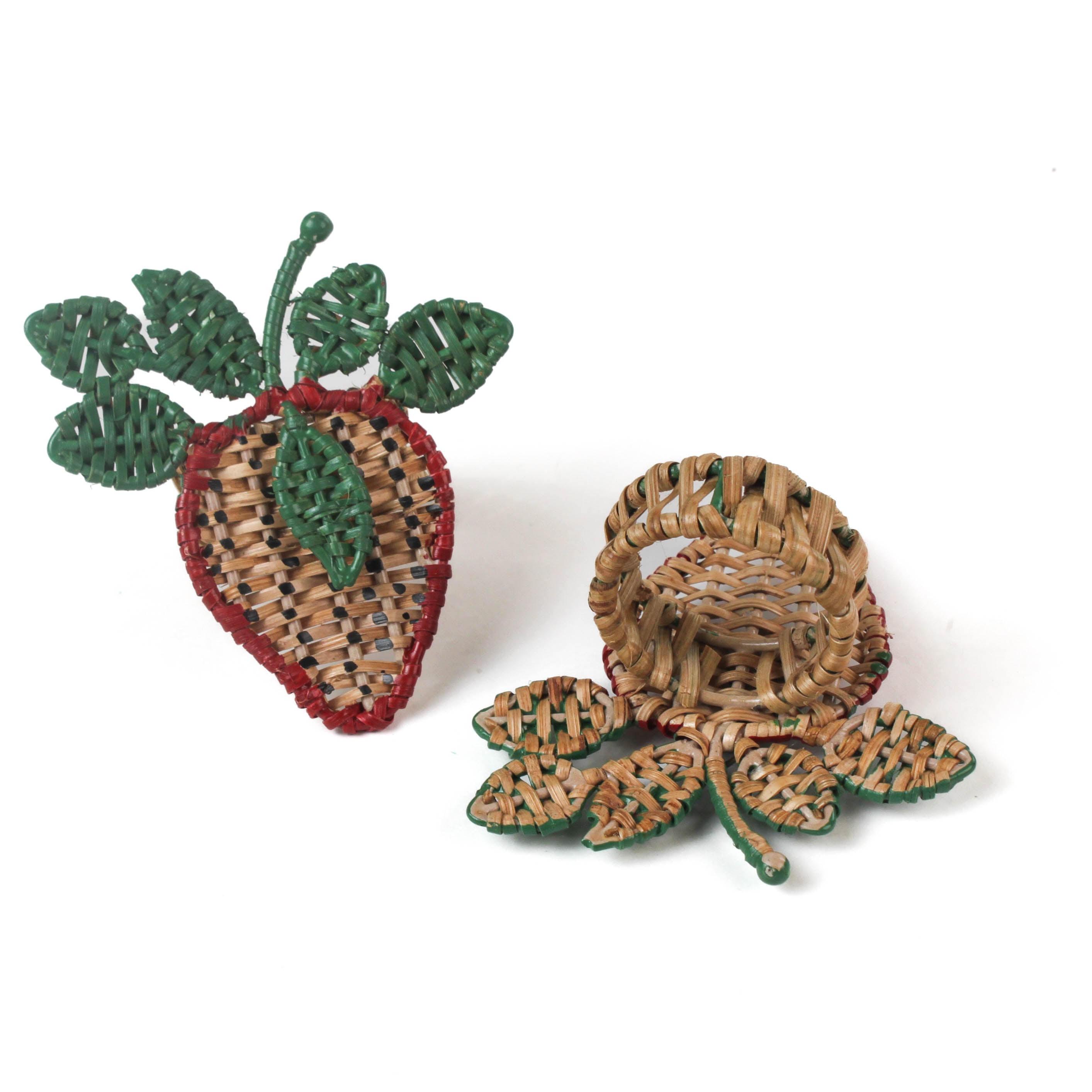 two  strawberry rattan napkin rings on a white background