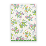 Strawberry Spring Flowers cotton tea towel featuring colorful spring blossoms, playful white rabbits, green foliage, and green scalloped trim.