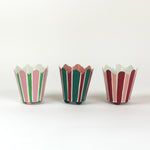 three striped cachepots in shades of pink, red and green from madcap cottage