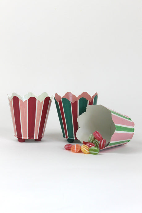 three striped cachepots in shades of pink, red and green from madcap cottage