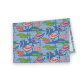 Folded sunken gardens flamingo cotton tea towel featuring pink flamingos, green lily pads, and colorful water flowers.  