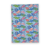 Sunken gardens flamingo cotton tea towel featuring pink flamingos, green lily pads, and colorful water flowers.  