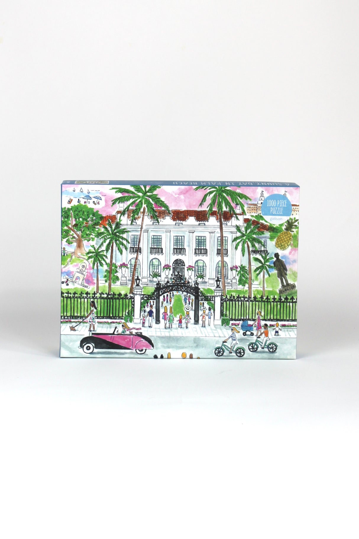 a 1000 piece jigsaw puzzle featuring an illustration of the a white building in palm beach florida. 