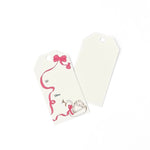 Swan Christmas gift tag featuring an elegant white swan, flowing pink ribbon, delicate bow accents, and printed To and From fields for personalized holiday gifting.