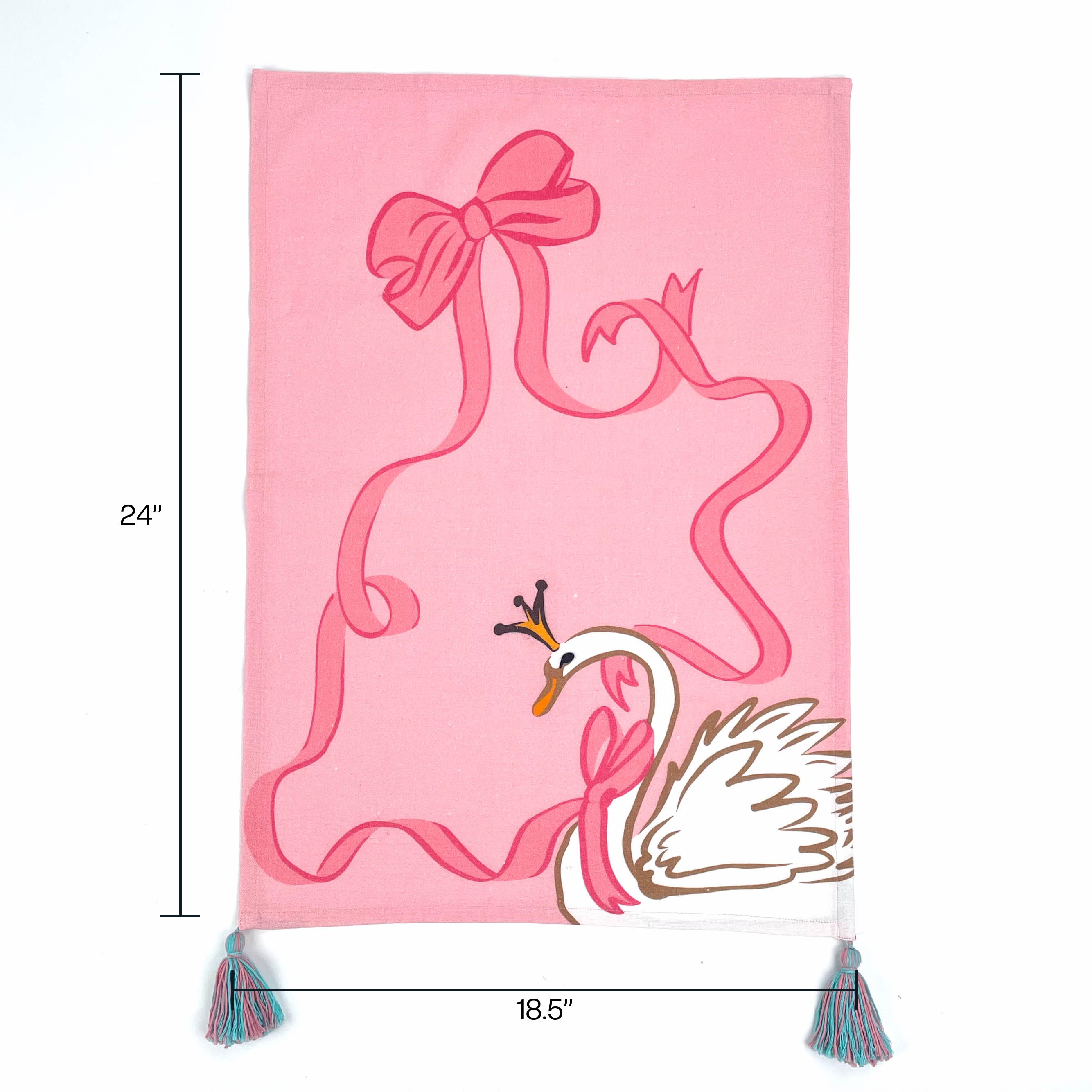 pink christmas tea towel featuring a large swan and pink ribbon design and blue and pink tassels with dimension 24" x 18.5" denoted with arrows