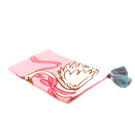 pink christmas tea towel featuring a large swan and pink ribbon design and blue and pink tassels