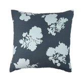 Navy blue floral outdoor pillow with elegant white blooms.