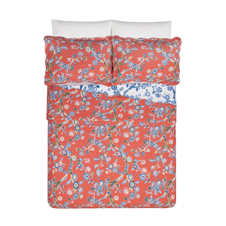 Temple Garden 3pc reversible bed set on a bed frame with pillows