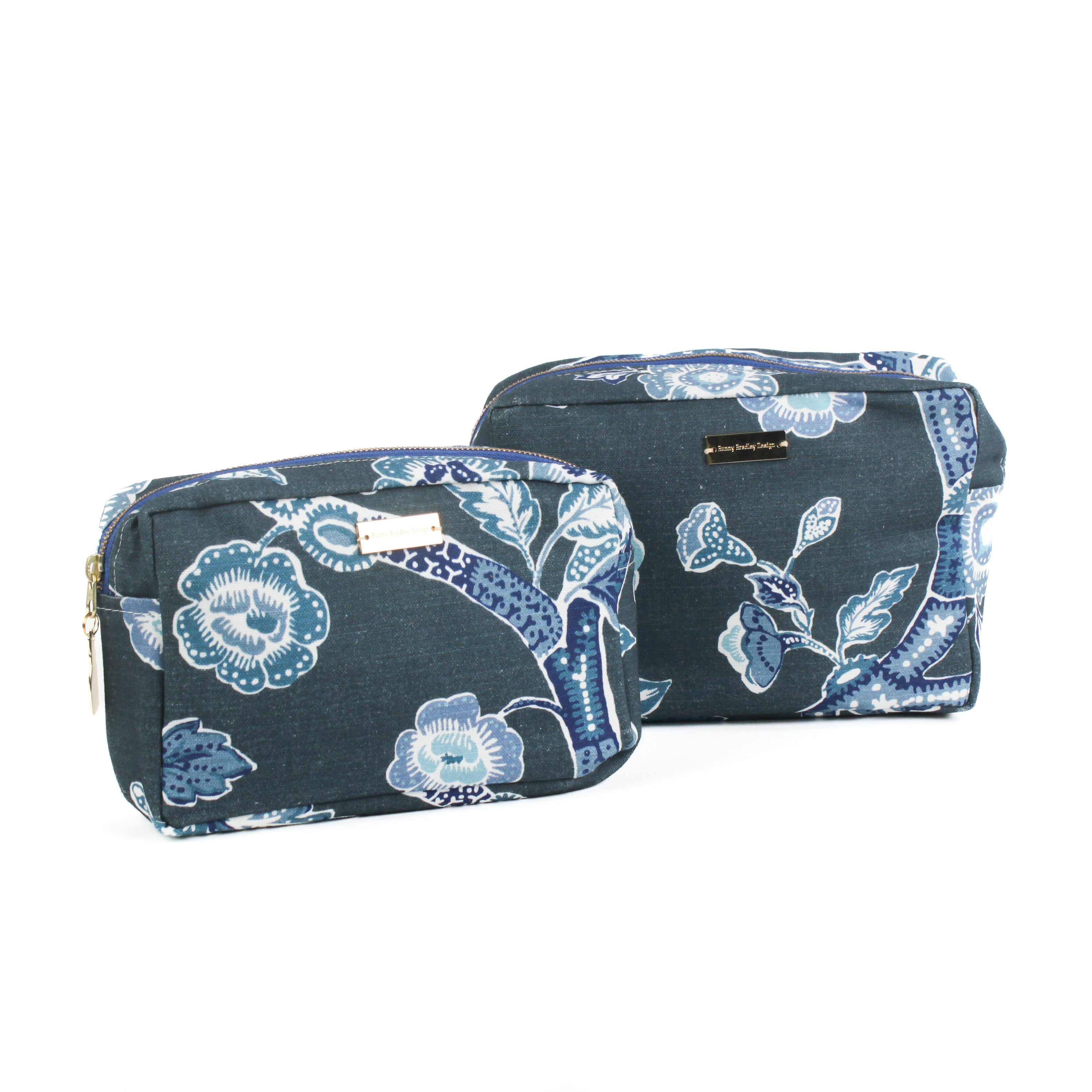 a set of large and medium Temple Garden toiletry bag in navy blue features light blue floral motif.