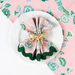 design pink and green chinoiserie cloth dinner napkin in temple garden print in white plate with  ring style.
