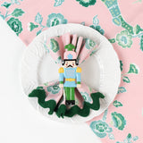 design pink and green chinoiserie cloth dinner napkin in temple garden print in white plate with style.
