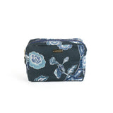 a large Temple Garden toiletry bag in navy blue features light blue floral motif.