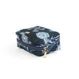 a large Temple Garden toiletry bag in navy blue features light blue floral motif.