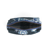 an inside view of a large Temple Garden toiletry bag in navy blue features light blue floral motif.