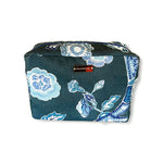 Temple Garden toiletry bag in navy blue features light blue floral motif.
