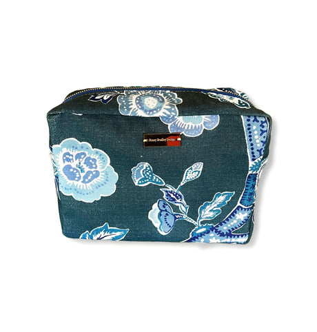 Temple Garden medium sized toiletry bag in navy blue features light blue floral motif.