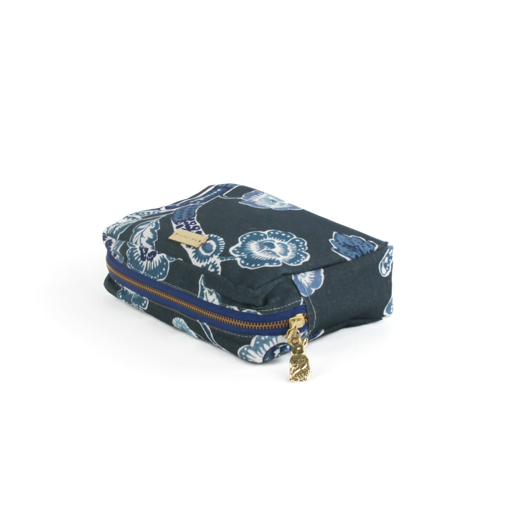 a medium Temple Garden cosmetic/toiletry bag in navy blue features light blue floral motif.