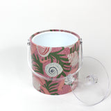 Top view of Shell Seekers, a pink acrylic ice bucket from madcap cottage covered in shell and seaweed motifs