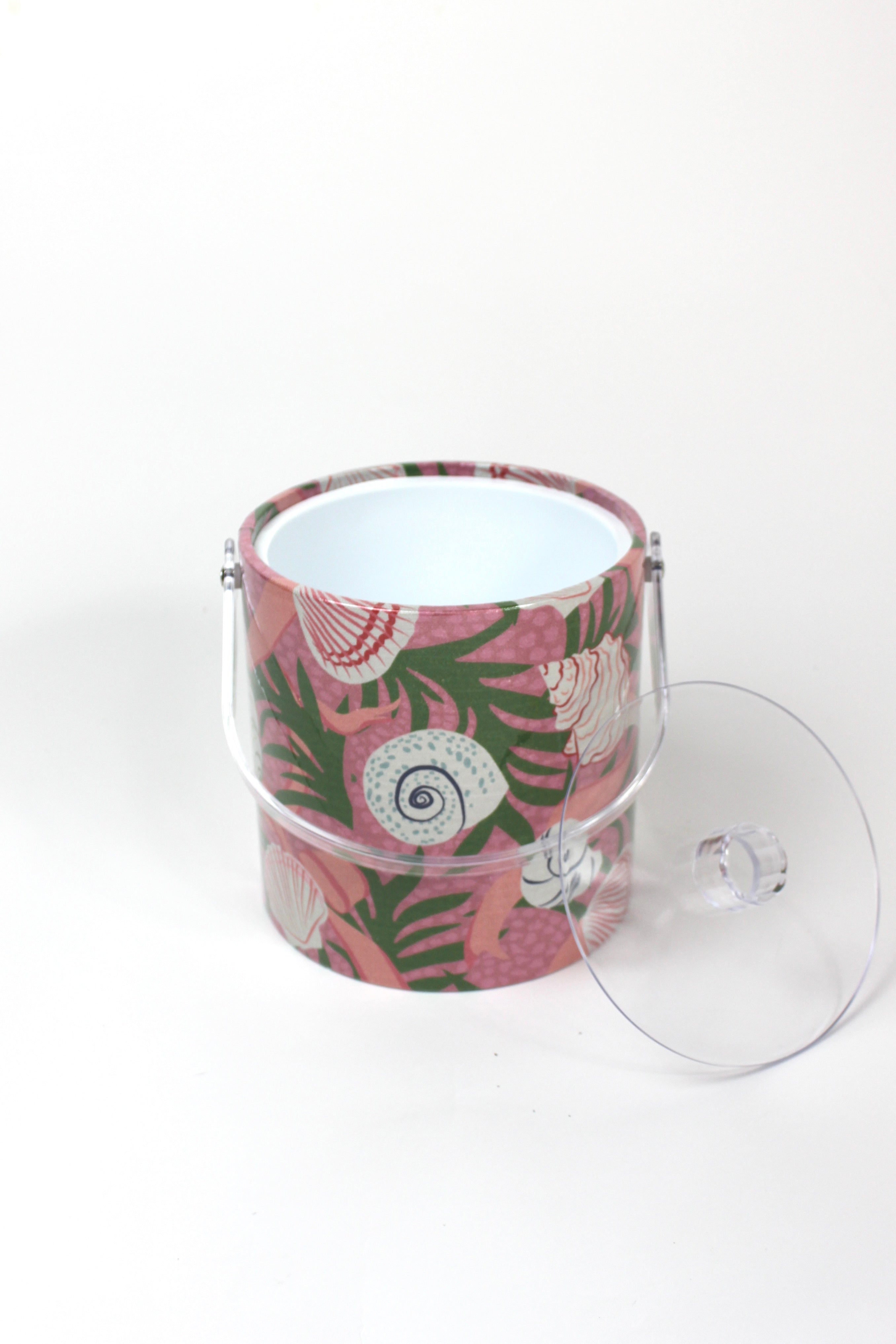 Top view of Shell Seekers, a pink acrylic ice bucket from madcap cottage covered in shell and seaweed motifs