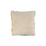 back of hooked pillow with red tulip floral design on green background