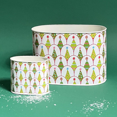 Two sizes of round, decorative caddies with a Christmas tree and gift pattern design, one large and one small, against a green background.