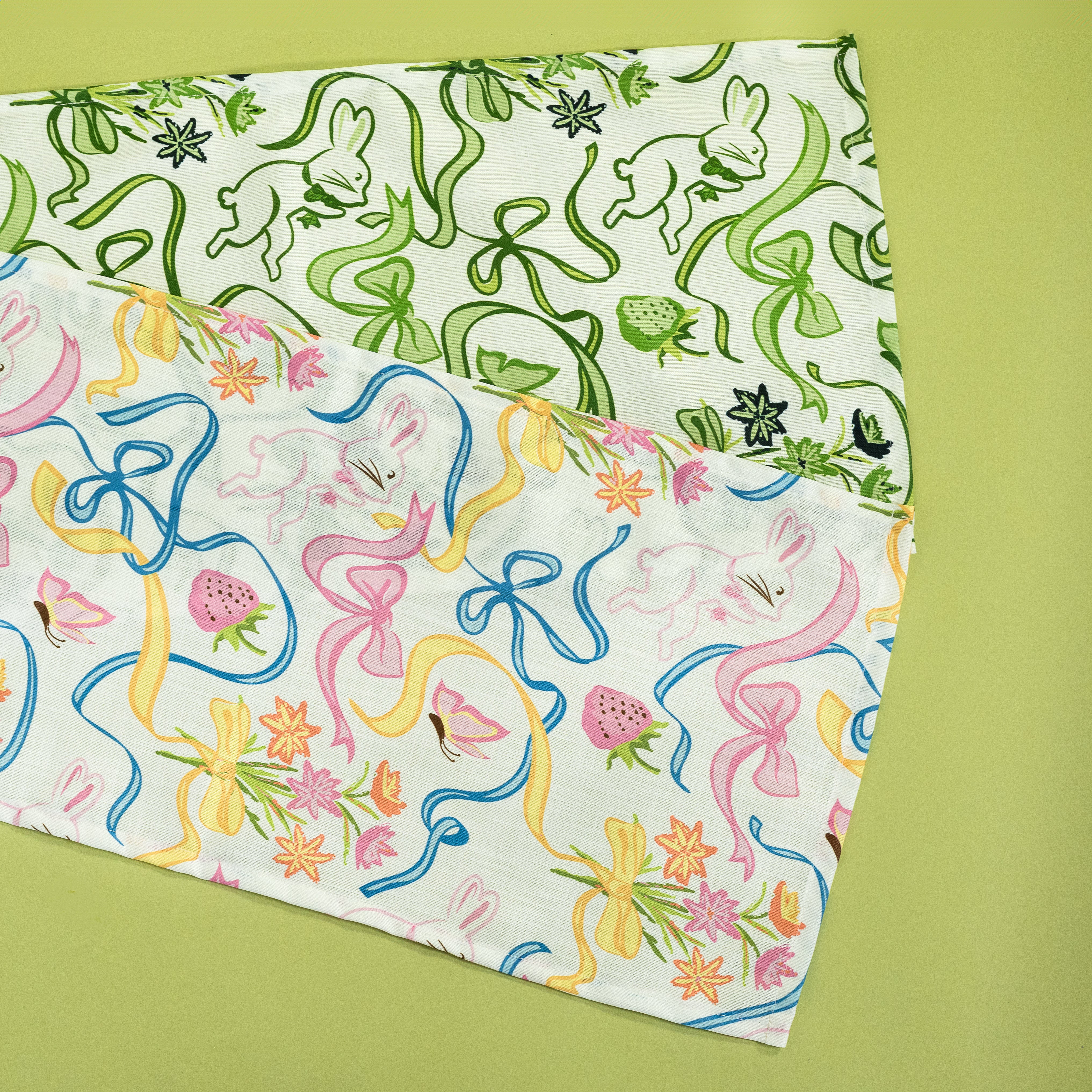 Two table runners in a madcap cottage bunnies and bow print fabric.