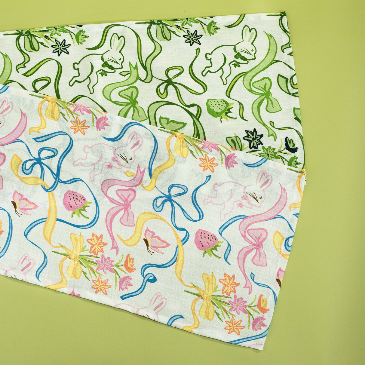 Two table runners in a madcap cottage bunnies and bow print fabric.
