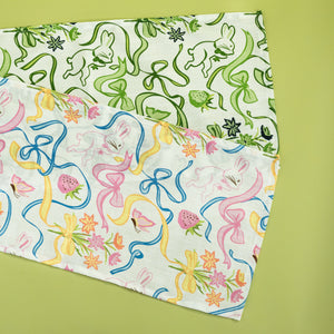Two table runners in a madcap cottage bunnies and bow print fabric.