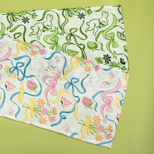 Two table runners in a madcap cottage bunnies and bow print fabric.