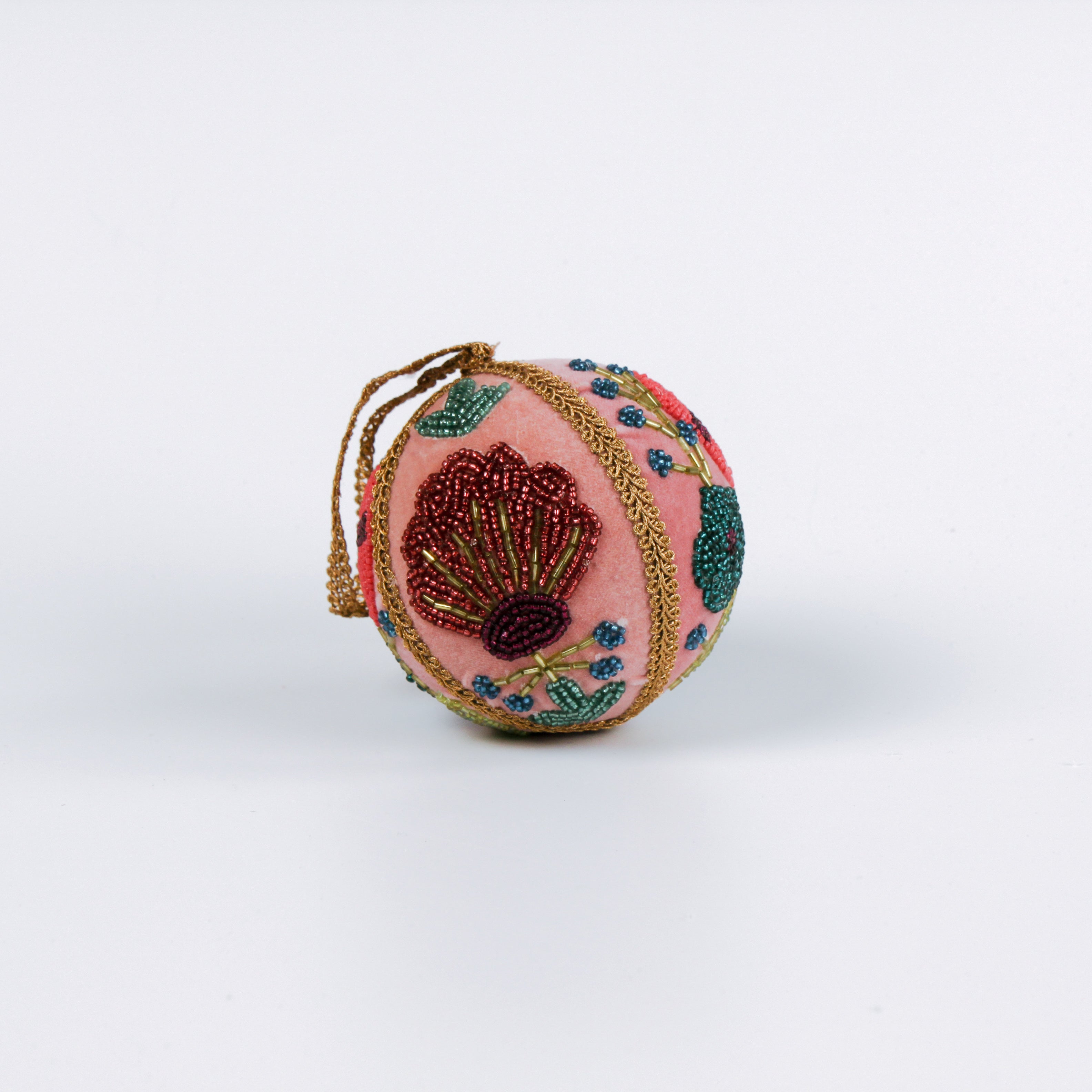 Set of two velvet Christmas ball ornaments in soft pink, beautifully hand-embroidered with beaded floral designs and finished with gold braided trim and hanging loops