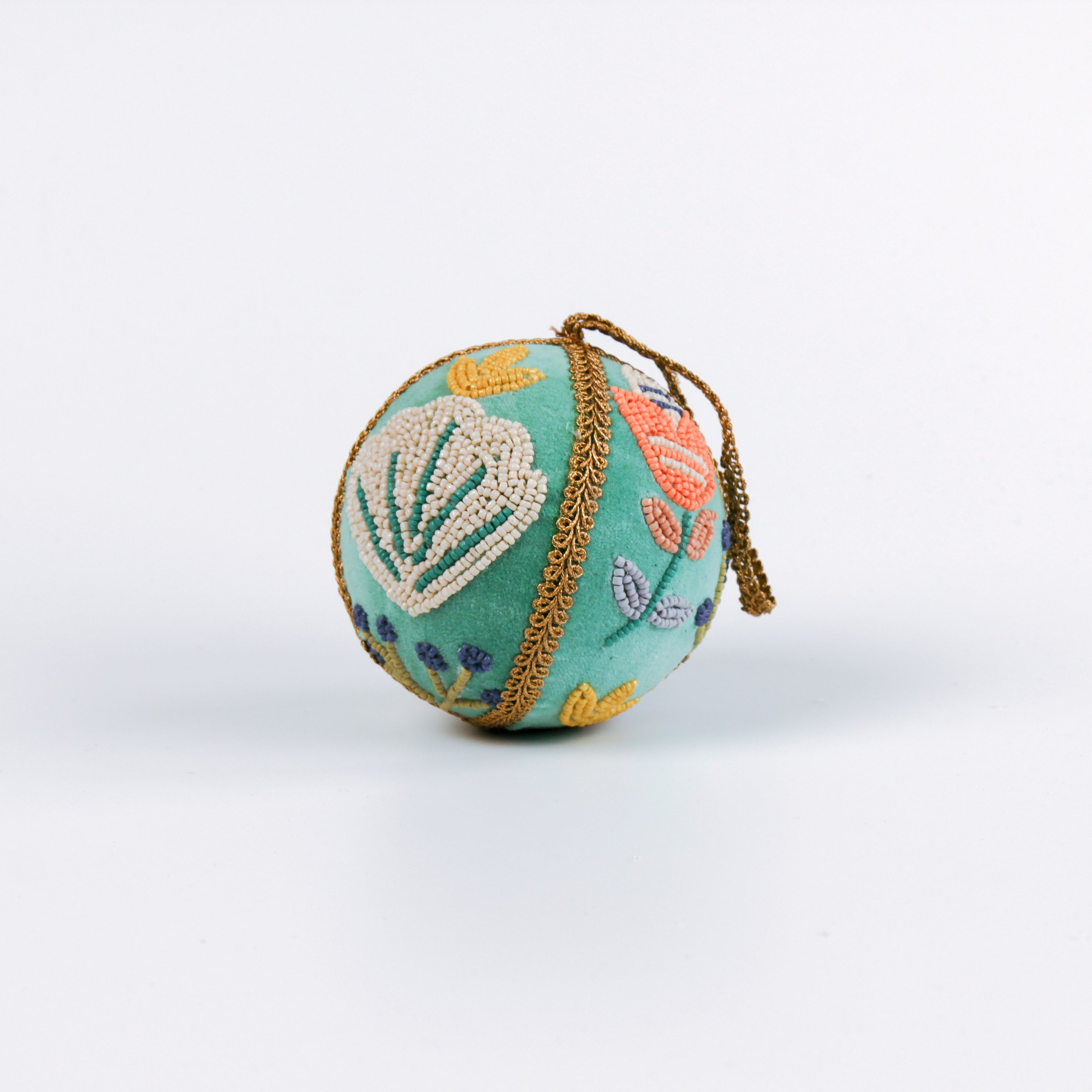 velvet Christmas ball ornaments in mint green, beautifully hand-embroidered with beaded floral designs and finished with gold braided trim and hanging loops
