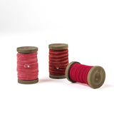 set of 3 Velvet Ribbon on Wood Spool in a white background