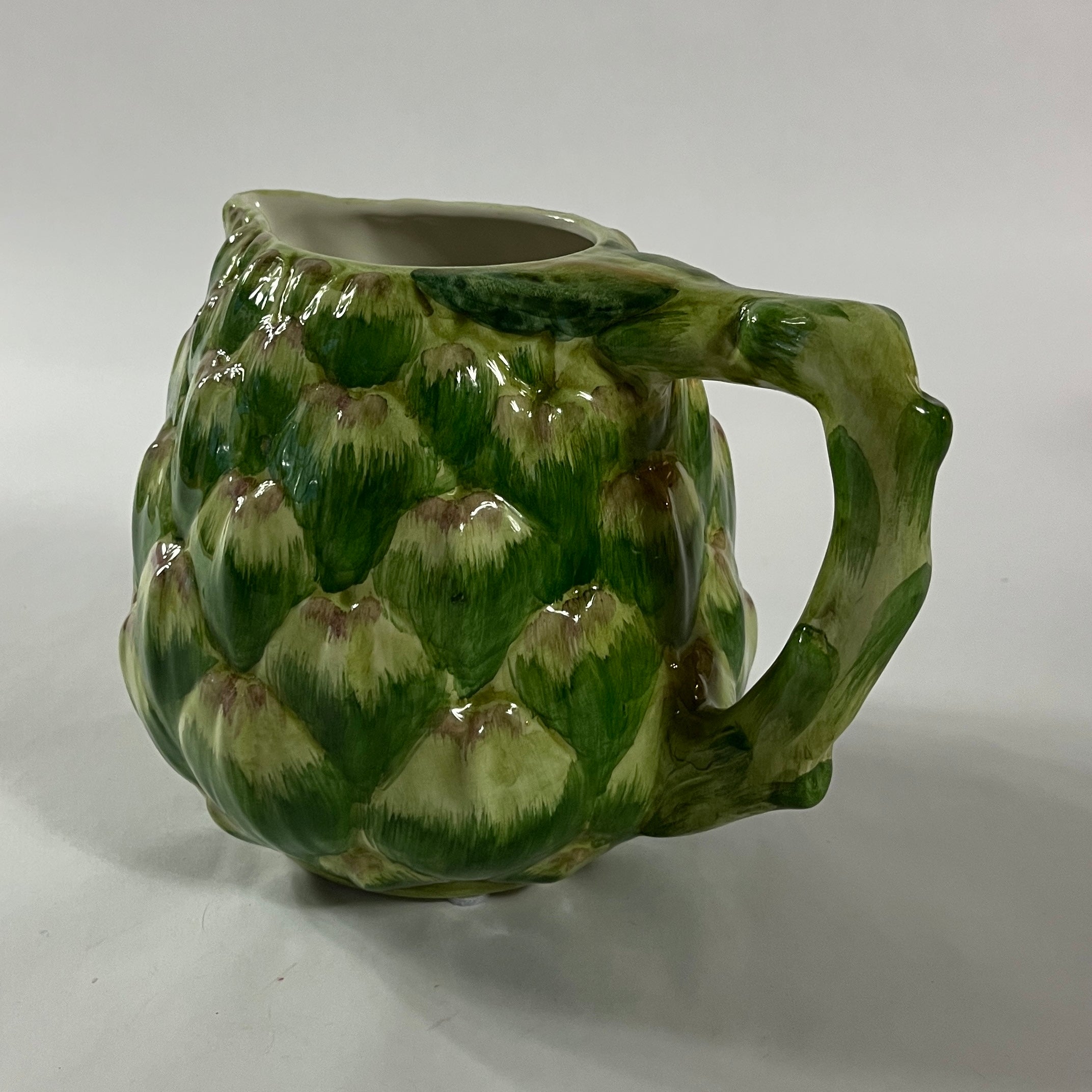 Vintage ceramic water pitcher with sculpted green artichoke design and handle