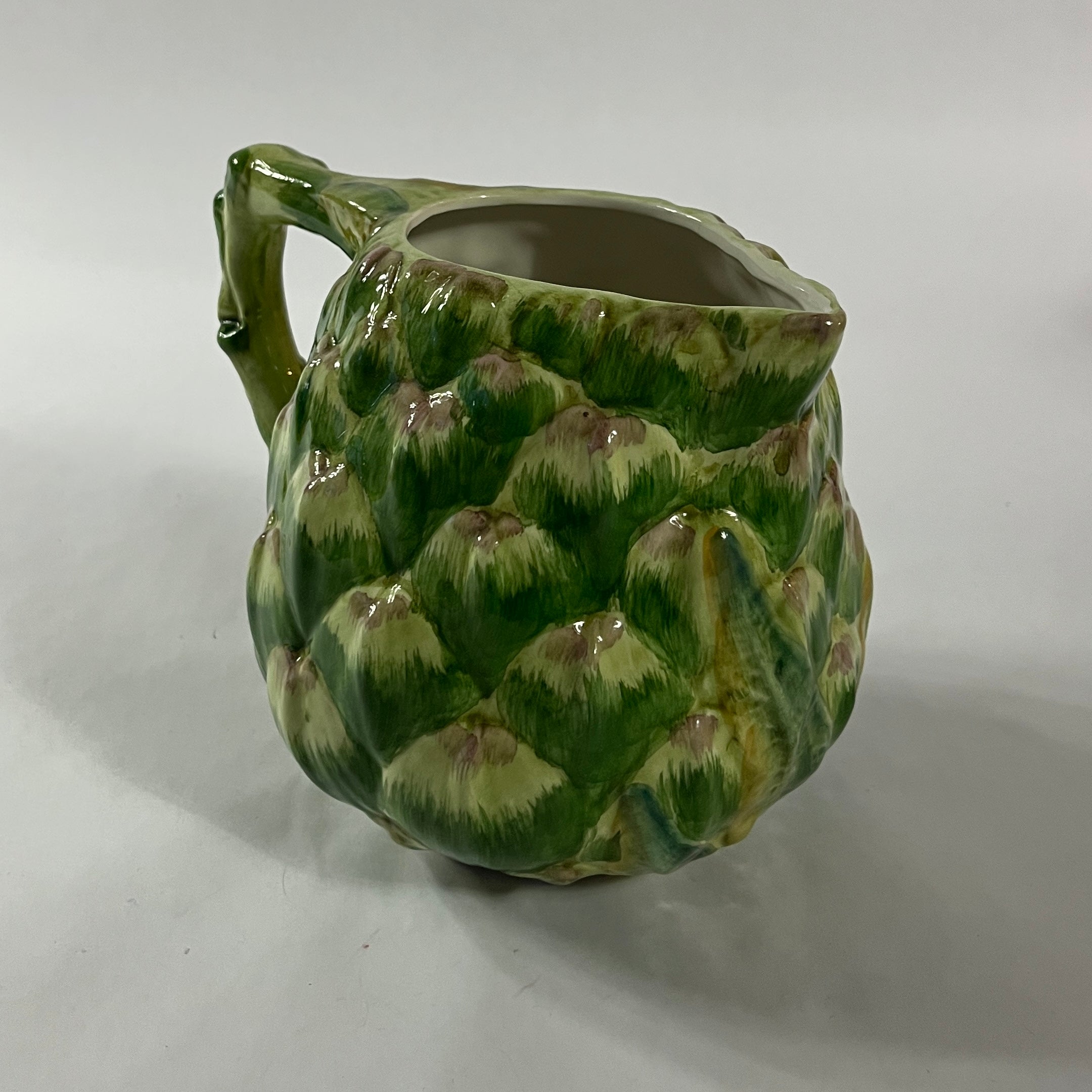 Vintage ceramic water pitcher with sculpted green artichoke design and handle