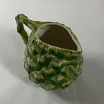 Vintage ceramic water pitcher with sculpted green artichoke design and handle