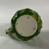 Bottom of Vintage ceramic water pitcher with sculpted green artichoke design and handle