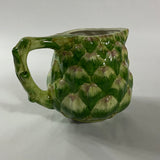 Side of Vintage ceramic water pitcher with sculpted green artichoke design and handle