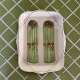 Vintage ceramic serving platter featuring raised green asparagus bundles with decorative detail