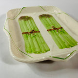 Vintage ceramic serving platter featuring raised green asparagus bundles with decorative detail