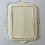 Back of Vintage ceramic serving platter featuring raised green asparagus bundles with decorative detail