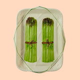 Vintage ceramic serving platter featuring raised green asparagus bundles with decorative detail